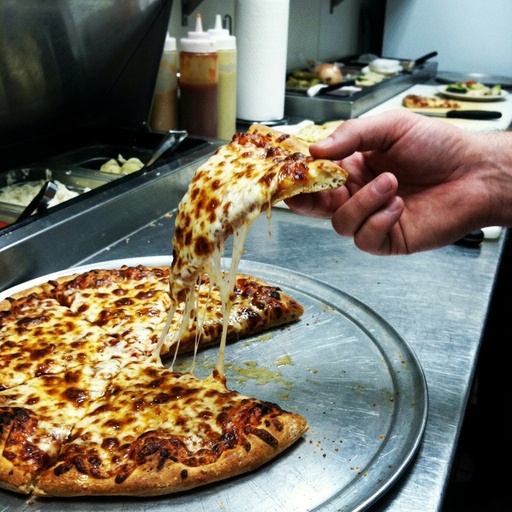 cheese-pull slice being lifted Pizza, before